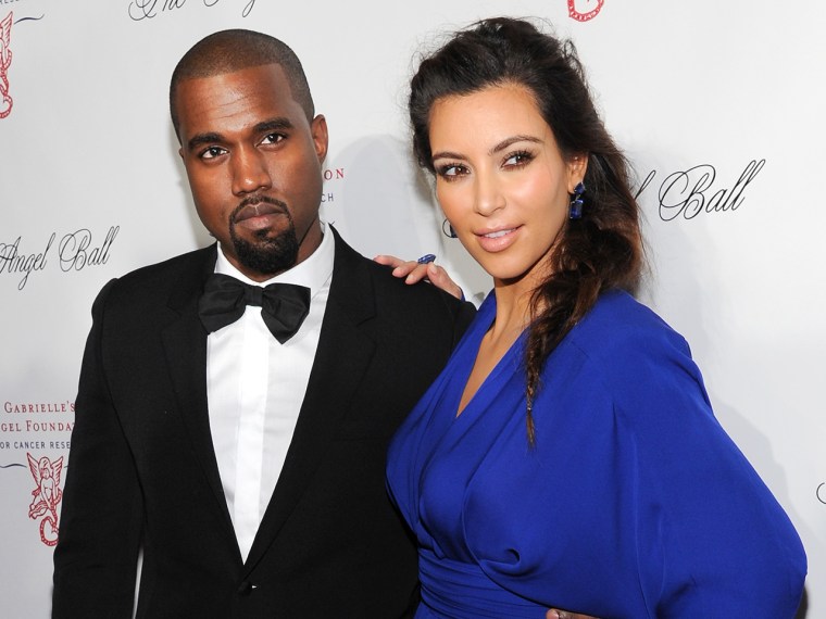FILE - In this Oct. 22, 2012 file photo, singer Kanye West and girlfriend Kim Kardashian attend a benefit in New York. Reports attributed to anonymous...