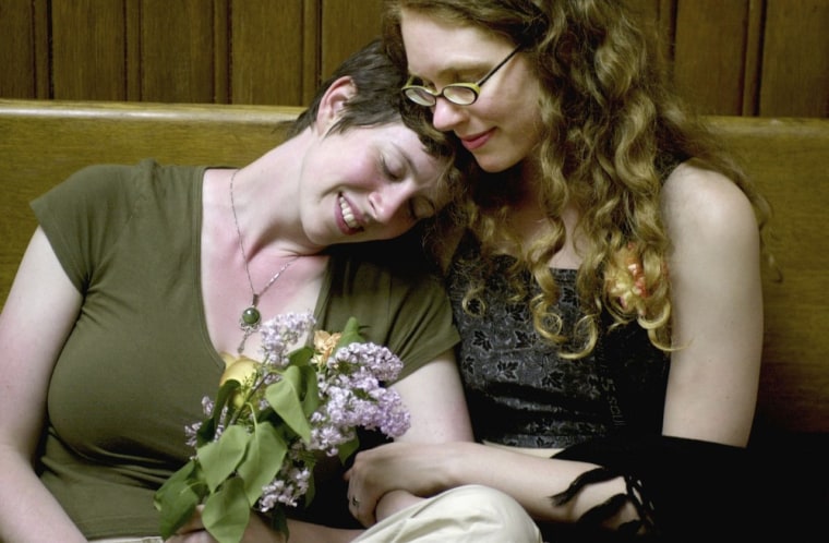 CAMBRIDGE, MA - MAY 17: Jes Shuford (L) and Shannon Andrews wait their turn to apply for a marriage licence in the early hours of May 17, 2004 in Cambridge, Massachusetts. Cambridge City Hall opened its doors before midnight to become the first city in Massachusetts to issue licenses for same sex marriages, which were made possible by a landmark state Supreme Judicial Court ruling . (Photo by Michael Springer/Getty Images)
