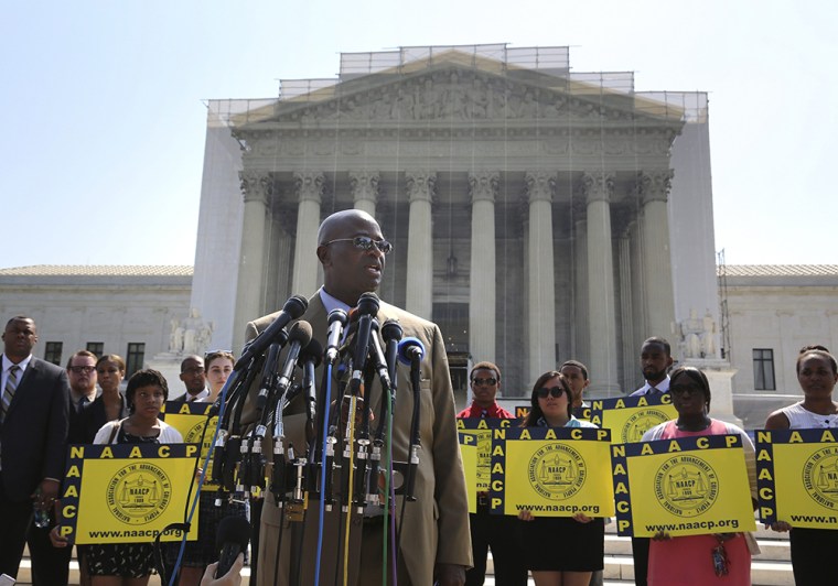 NAACP National Field Director Rev. Charles White speaks to reporters after the U.S. Supreme Court struck down part of a federal law designed to protect minority voters, at the court's building, June 25, 2013.