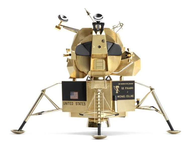 Lunar landing module by Cartier, French; made of yellow gold, white gold, black lacquer, and red, white, and blue enamel.