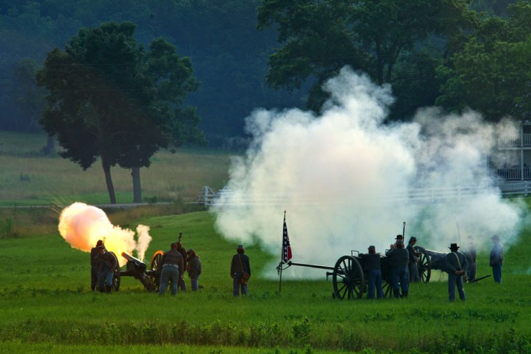 Confederate artillerymen fire at Union positions during a re-enactment of the Battle of Gettysburg on June 29.