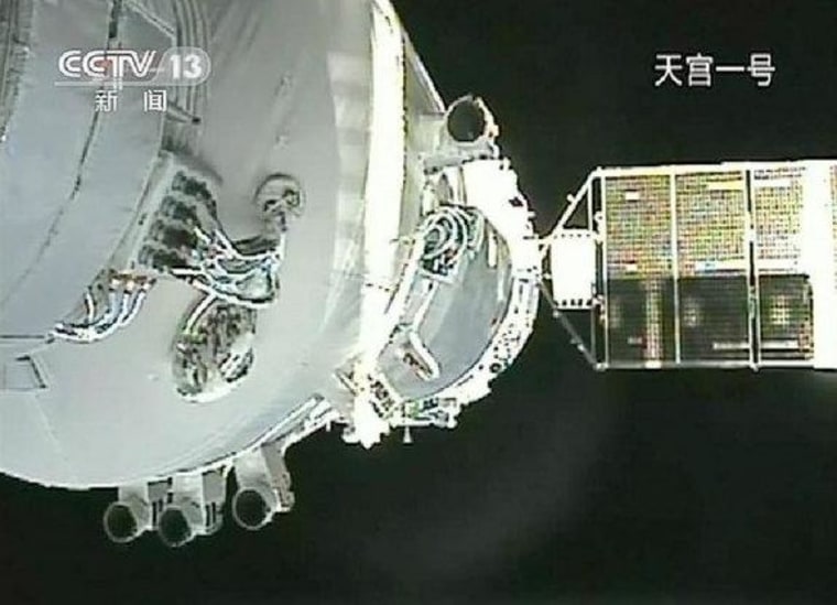 This video still shows China's Shenzhou 8 spacecraft docking with the Tiangong 1 lab module on Nov. 3, 2011.