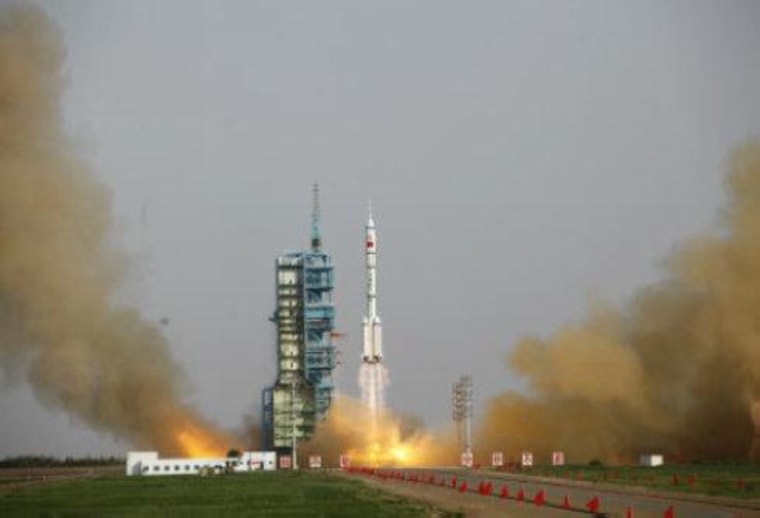 A Chinese Long March 2F rocket launches on the Shenzhou 9 mission, China's first manned space docking flight and first flight of a female astronaut, on June 16, 2012 from the Jiuquan Satellite Launch Center.