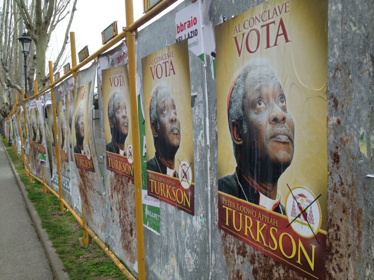 As cardinals prepare to choose who will be the next pope, posters seen on the streets of Rome appear to implore them to choose Ghanaian cardinal Peter Turkson.