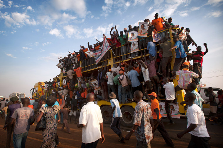 Supporters of Raila Odinga are pictured here traveling home after a major rally in Kisumu town on March 1, 2013. Kisumu town is the home of Kenyan Prime Minister Raila Odinga, and a hotbed of support for ODM and CORD. Kenya is to hold general elections on March 4.