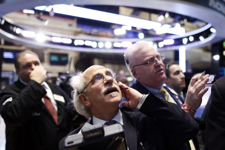 Traders work on the floor of the New York Stock Exchange, March 1, 2013.