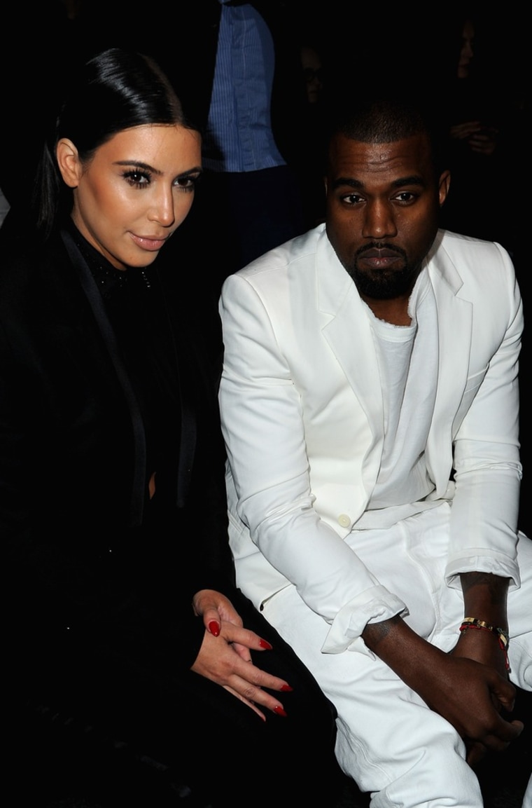 Cute or not? Kim Kardashian and Kanye West in Givenchy suits.