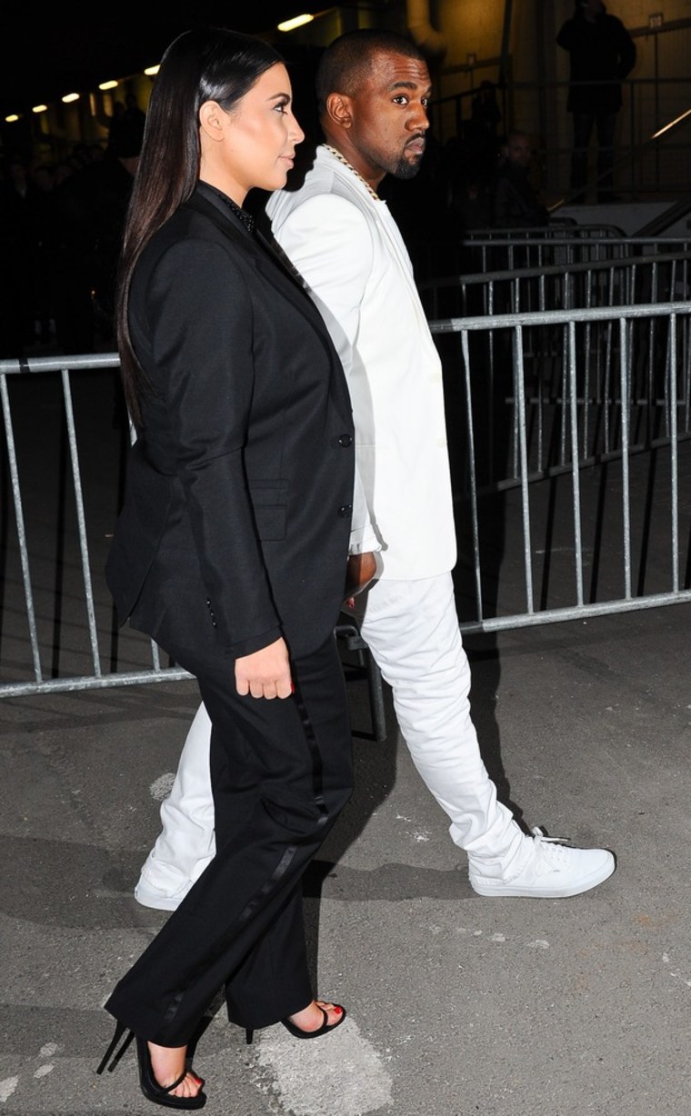Kim Kardashian and Kanye West arrive at Givenchy's show in Paris.