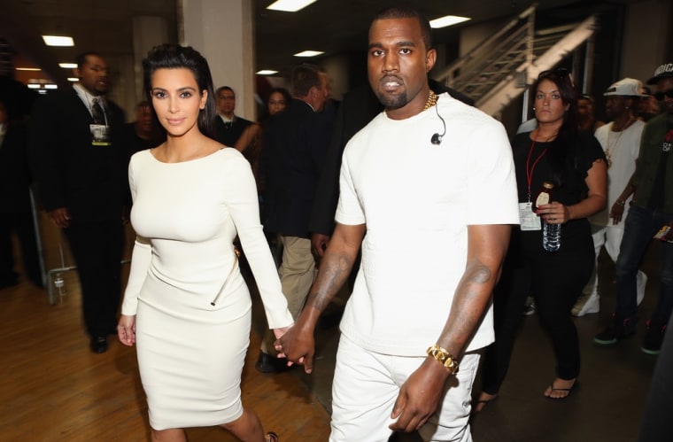 Bright white: Kim and Kanye wear matching outfits.