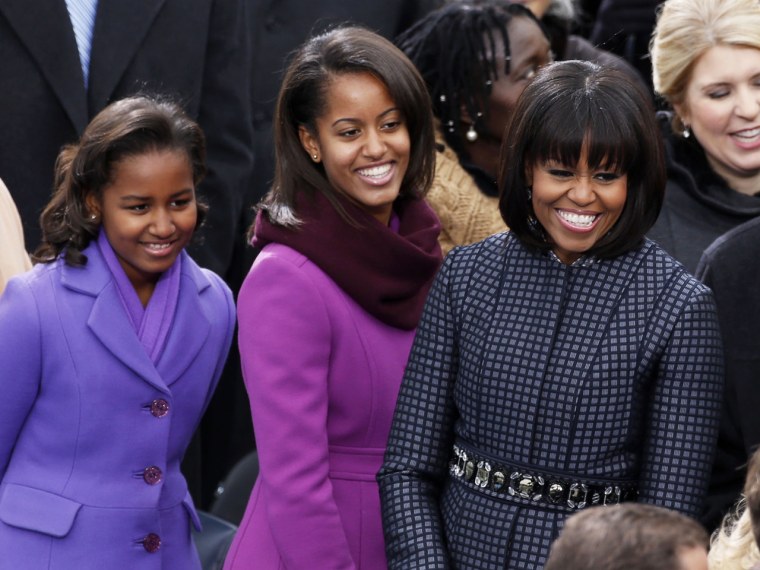 Sasha Obama, (L), Malia Obama and Michelle Obama (R) smile ahead of the swearing-in ceremonies for U.S. President Barack Obama on the West front of th...