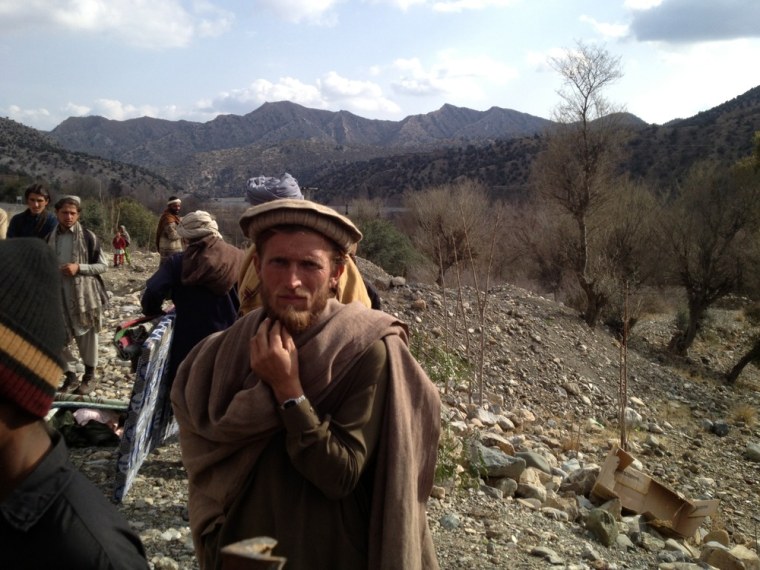 A tribesman waits in line at a 'Distribution Camp' set up on the side the newly constructed Tank-Makeen road in South Waziristan. Radios and mattresses are the items of choice popular amongst locals, who belong to one of the most impoverished communities in Pakistan.