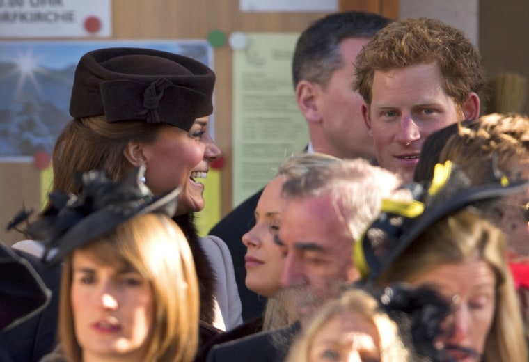 The duchess shares a laugh at the wedding with Prince Harry, who was her official escort since her husband was serving as an usher.