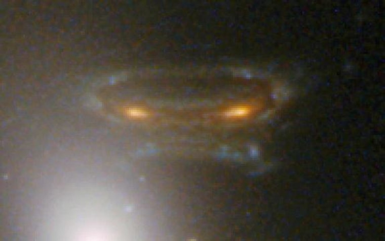 A gravitationally lensed photograph of distant galaxy in Abell 68. This image was released on Tuesday.