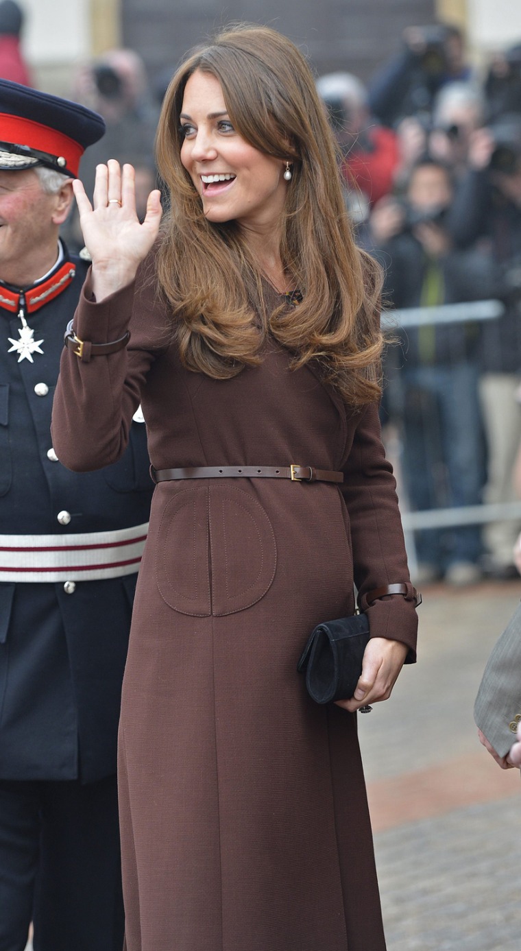 For the first time, a tiny baby bump is visible as Kate arrives in Grimsby, England.