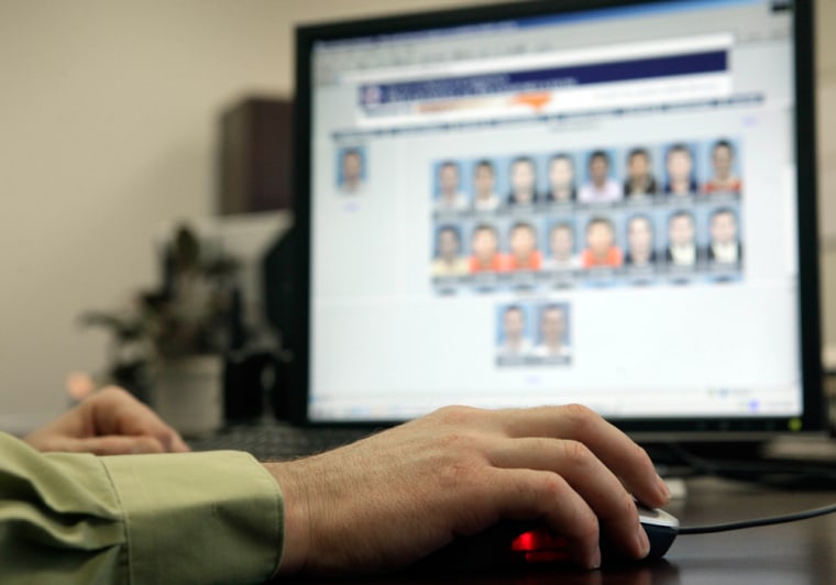 Stephen Lamm, supervisor with the ID Fraud Unit of the North Carolina Department of Motor Vehicles looks through photos in the facial recognition syst...