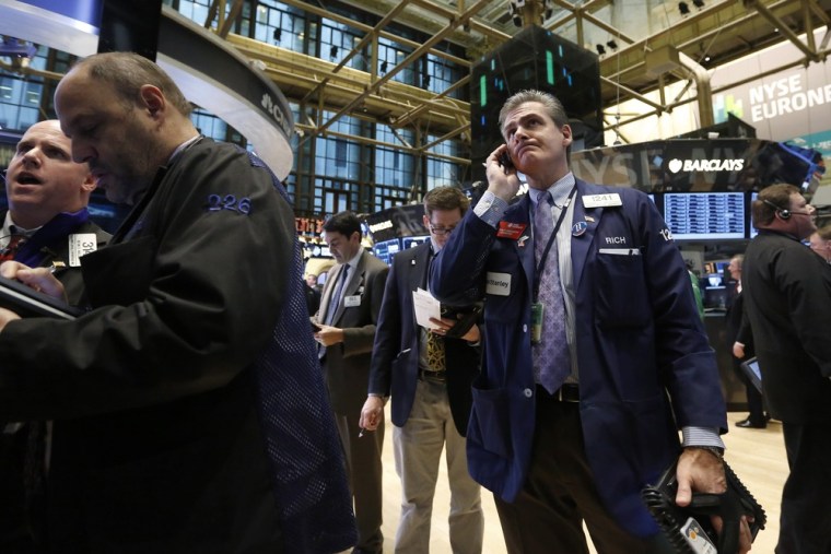 Things seem to be looking up. Traders work on the floor at the New York Stock Exchange, March 6, 2013.