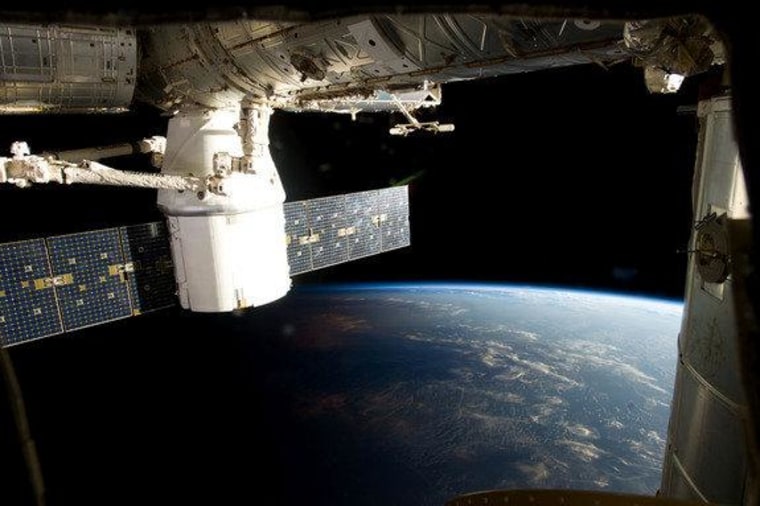 The Dragon capsule has begun its scheduled three-week-long stay at the orbiting space station.