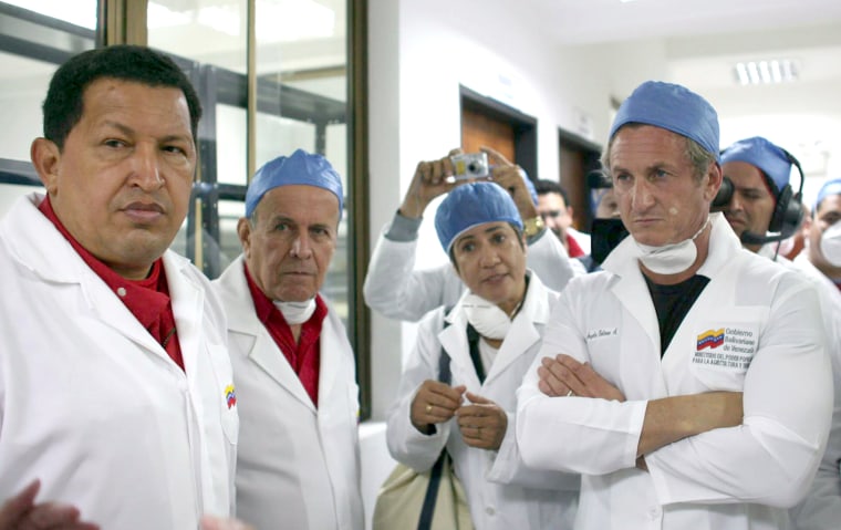 Venezuelan President Hugo Chavez and actor-director Sean Penn listen to an explanation from a doctor during a visit to a hospital Aug. 3, 2007 in San Cristobal, Venezuela.