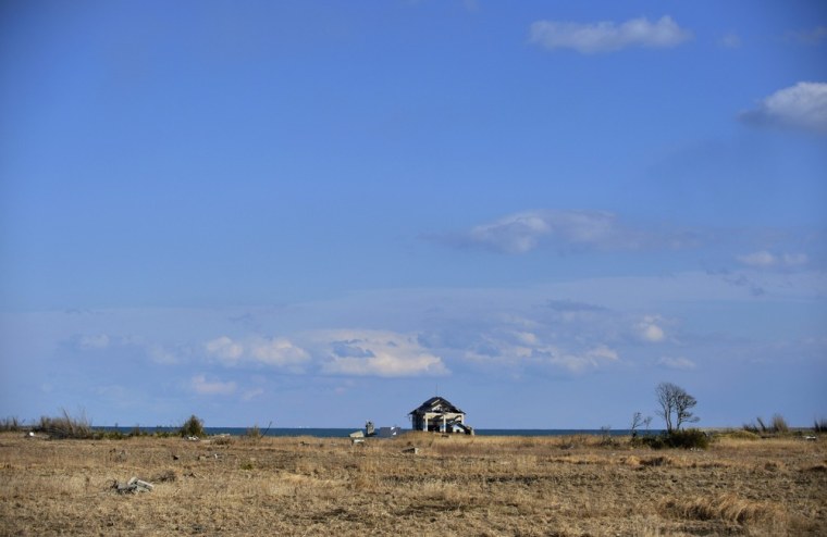 A single house remains standing in an area wiped out by the tsunami near Ukedo port in the town of Namie.