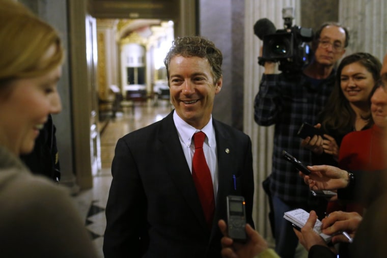 Rand Paul speaks to reporters after leaving the floor of the Senate.