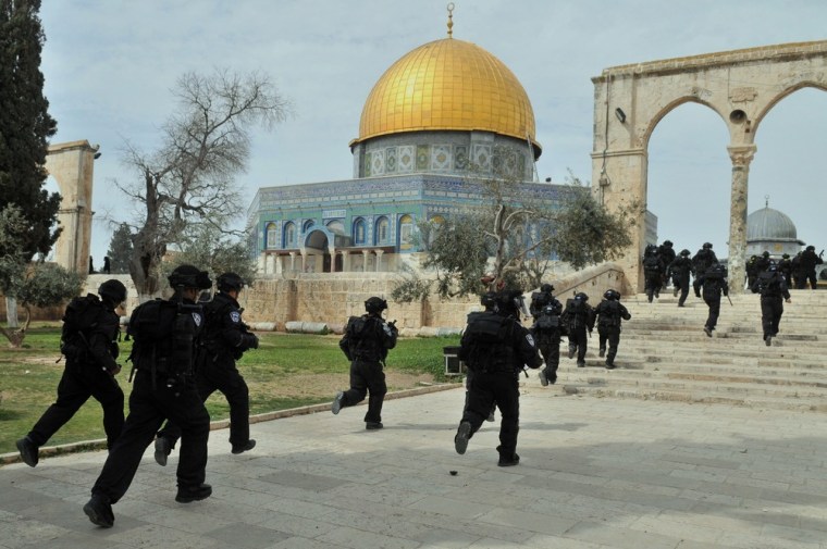 Israeli forces enter the Al-Aqsa mosque compound in Jerusalem on March 8, 2013. Clashes erupted between Palestinian worshipers and Israeli forces during Friday prayers.