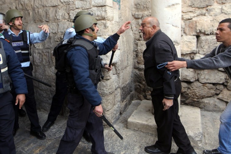 A Palestinian man argues with Israeli police in the Old City of Jerusalem on March 8, 2013.