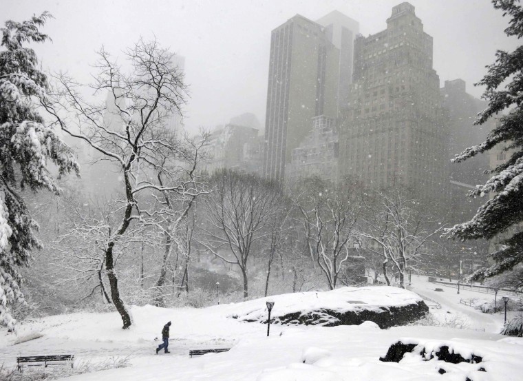 A man walks through Central Park after a snowstorm blanketed the park in New York, on March 8. A slow moving winter storm brought a combination of snow, rain and high winds to the northeast U.S. Friday after moving through the mid-Atlantic states earlier in the week.