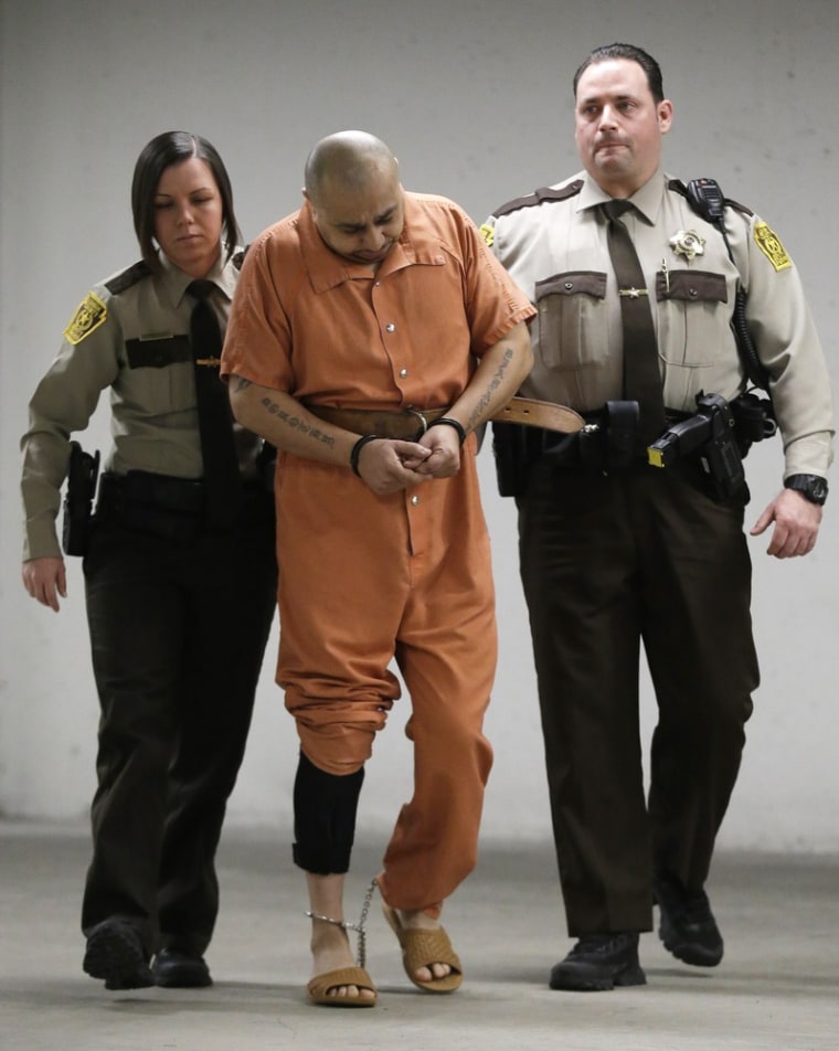 Julio Acevedo is escorted to a hearing at the Lehigh County Courthouse on Thursday in Allentown, Pa.