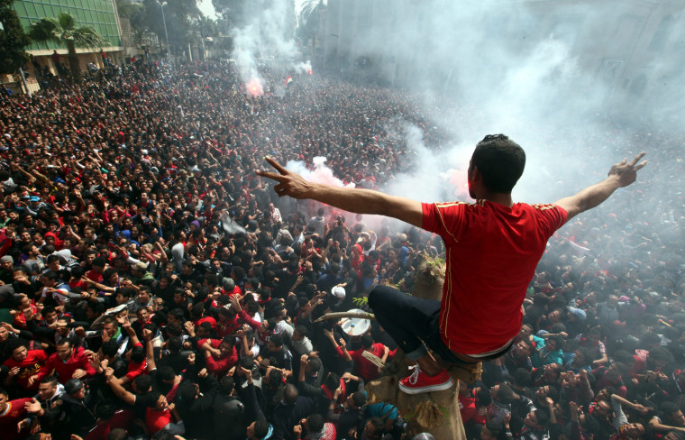 Supporters of the 'Al Ahly' soccer club celebrate after an Egyptian court confirmed verdicts in the Port Said soccer match riots, at the Al-Ahly football club in Cairo, March 9.