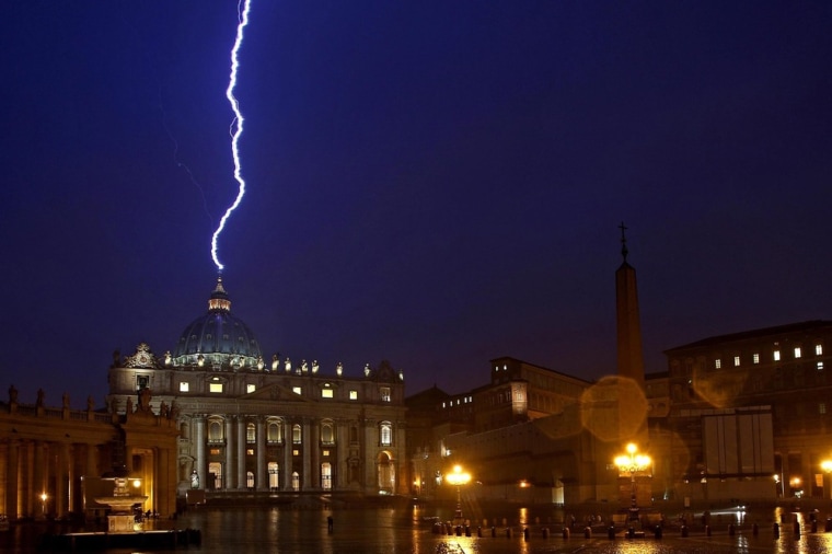 Lighting strikes the basilica of St.Peter's dome in Vatican City during a storm on Feb.11, 2013, the same day Pope Benedict XVI announced his resignation.