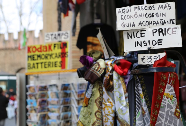 Souvenirs are displayed on a stand on della Concilizione road in Vatican City on March 9.