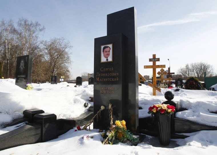 Flowers lie near the grave of lawyer Sergei Magnitsky in the Preobrazhensky cemetery in Moscow on March 11, 2013.