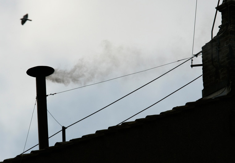 White smoke rises from the chimney above the Sistine Chapel in the Vatican, indicating a new pope has been elected, in this file picture taken April 19, 2005.