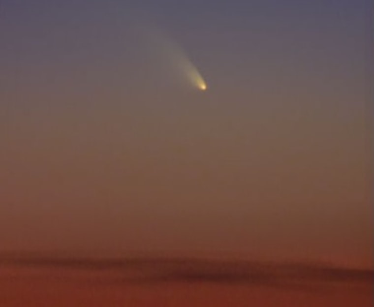 Comet PanSTARRS shines above the clouds on Tenerife in the Canary Islands on March 10.