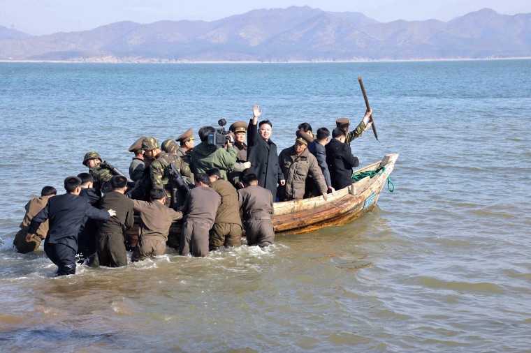 North Korean leader Kim Jong-Un waves while in a boat during his visit to the Wolnae Islet Defence Detachment in the western sector of the front line, which is near Baengnyeong Island of South Korea March 11, in this picture released by the North's official KCNA news agency in Pyongyang March 12, 2013. South Korea and U.S. forces are conducting large-scale military drills, while the North is also gearing up for a massive military exercise. North Korea has accused the U.S. of using the military drills in the South as a launch pad for a nuclear war and has said to scrap the armistice with the U.S. that ended the 1950-53 Korean War.