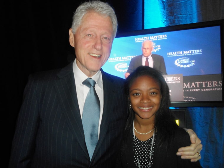 Haile poses with President Bill Clinton during the Clinton Foundation's Health Matters conference.