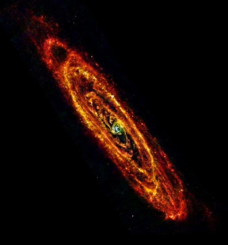 ESA Herschel space observatory image of Andromeda (M31) using both PACS and SPIRE instruments to observe at infrared wavelengths of 70 mm (blue), 100 mm (green) and 160 mm and 250 mm combined (red).
