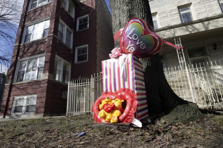 A makeshift memorial is seen in Chicago, Tuesday at the site where 6-month-old girl Jonylah Watkins, and her father were shot.