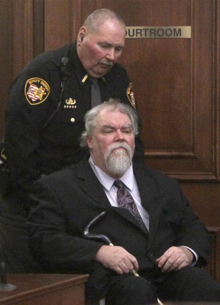 Richard Beasley is wheeled into court in Akron, Ohio, on March 6. On Tuesday he was found guilty of aggravated murder of three men who prosecutors say were lured to their deaths with job ads placed on Craigslist.