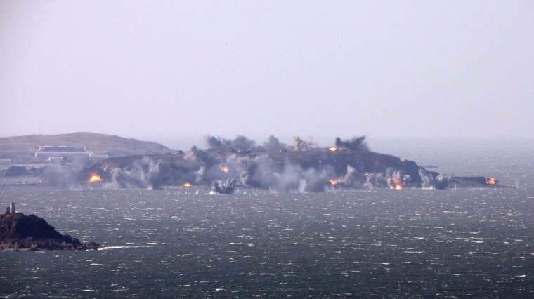 North Korea's artillery sub-units, whose mission is to strike Daeyeonpyeong island and Baengnyeong island of South Korea, conduct a live shell firing drill to examine war fighting capabilities in the western sector of the front line in this picture released by the North's official KCNA news agency in Pyongyang on Thursday.