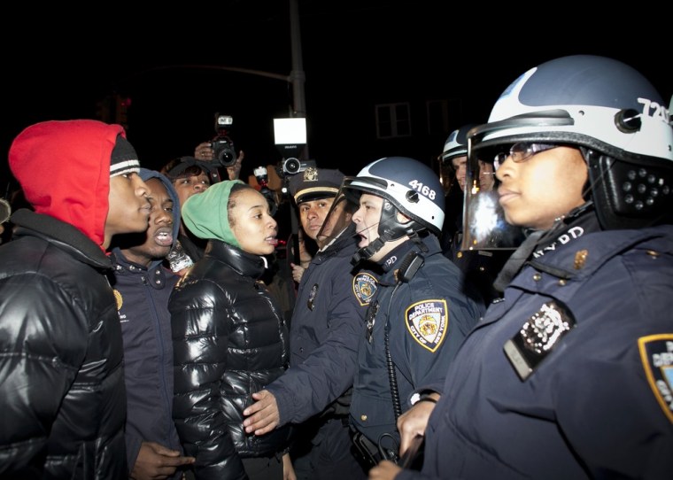 Demonstrators face-off against police during a protest against the shooting of Kimani Gray on March 13, 2013.