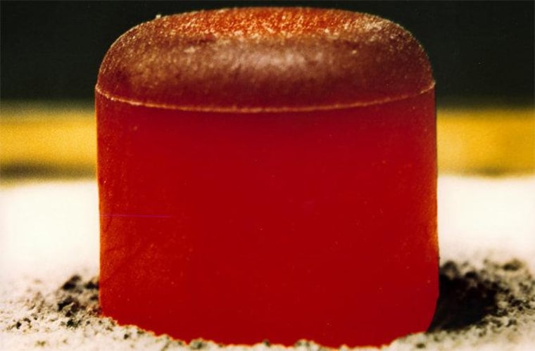 A glowing red hot pellet of plutonium-238 dioxide to be used in a radioisotope thermoelectric generator for space missions.