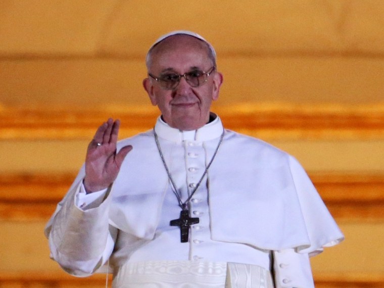 Habemus baby name! Newly elected Pope Francis I appears on the central balcony of St Peter's Basilica on March 13.