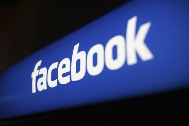 The Facebook logo at the Facebook headquarters in Menlo Park, California January 29, 2013. REUTERS/Robert Galbraith