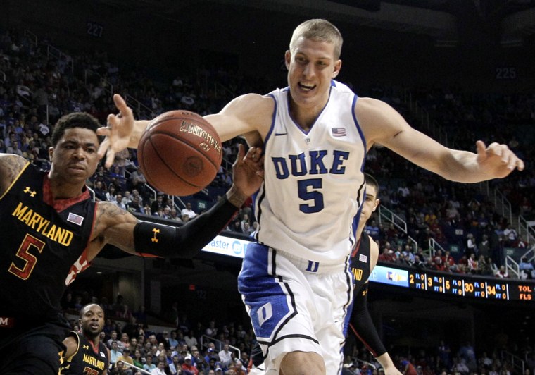 Duke's Mason Plumlee, right, and Maryland's Nick Faust, left, chase a loose ball during the first half of an NCAA college basketball game March 15 at the Atlantic Coast Conference men's tournament in Greensboro, N.C.
