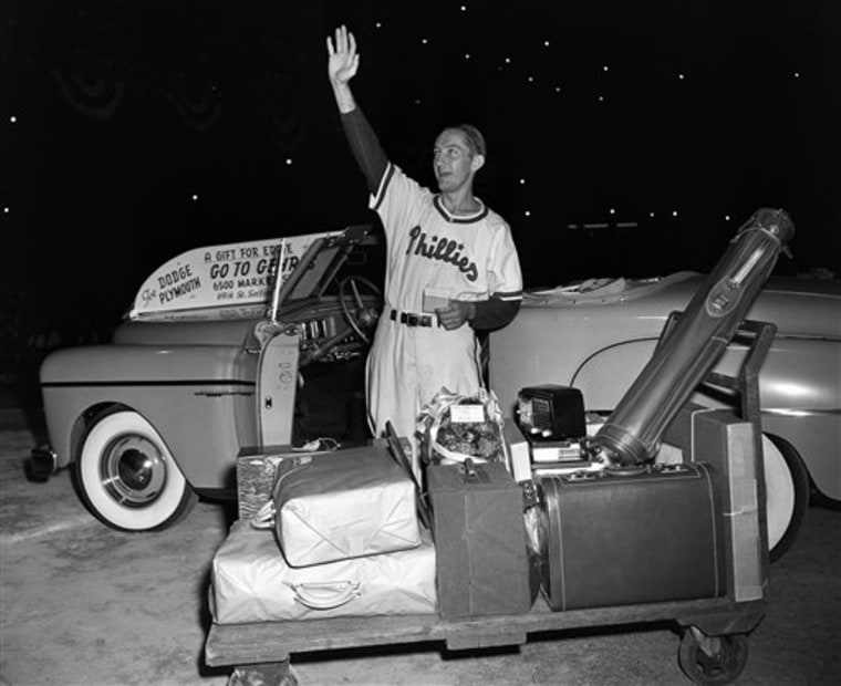 Philadelphia Phillies first baseman Eddie Waitkus acknowledges the applause of fans at Shibe Park as he stands by gifts showered on him on \"Eddie Waitkus Night\" in Philadelphia in 1949. Waitkus was in uniform for the first time since he was shot, June 14, 1949, in a Chicago hotel by 19-year-old Ruth Steinhagen.
