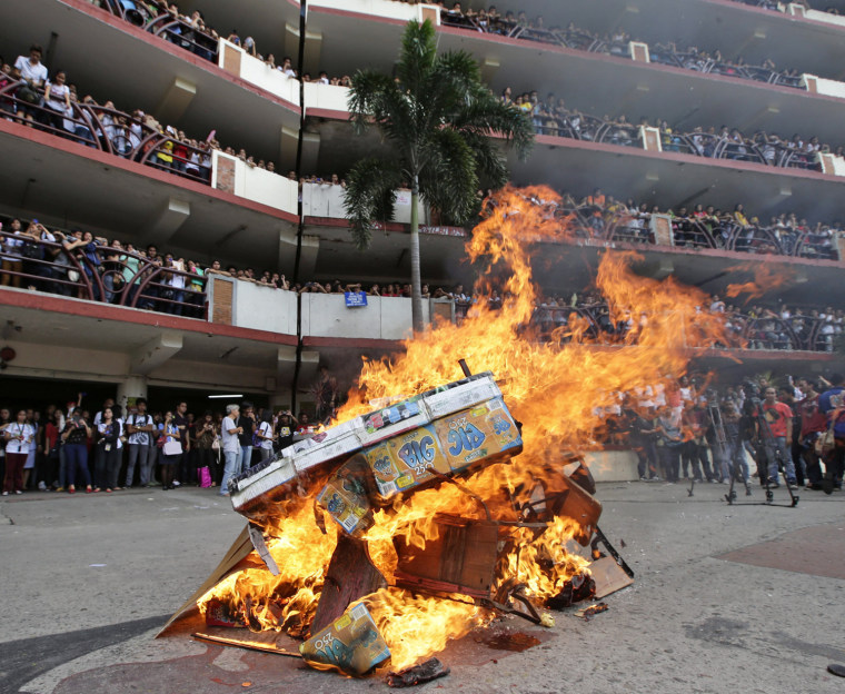 Chairs and tables are burned by student protesters.