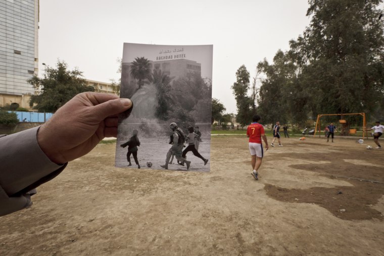 This Tuesday, March 12, 2013, photo shows a general view of Abu Nawas Park in Baghdad, at the site of a photograph taken by Maya Alleruzzo showing Iraqi orphans playing soccer with a U.S. soldier from the Third Infantry Division in April 2003. The park, which runs along Abu Nawas Street, named after an Arabic poet, is now a popular destination for families who are drawn by the manicured gardens, playgrounds and restaurants famous for a fish called mazgouf. Ten years ago, the park was home to a tribe of children orphaned by the war and was rife with crime.