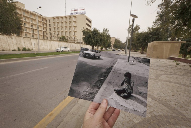 This Tuesday, March 12, 2013, photo shows a general view of Abu Nawas Street in Baghdad, Iraq, at the site of a photograph of Iraqi orphan Fady al-Sadik waking on the street taken by photographer Maya Alleruzzo in April 2003. The street abuts the well-manicured Abu Nawas Park, popular with families.