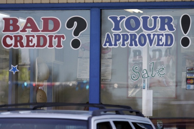 Signs advertising bad credit auto loans, in this 2008 file photo.